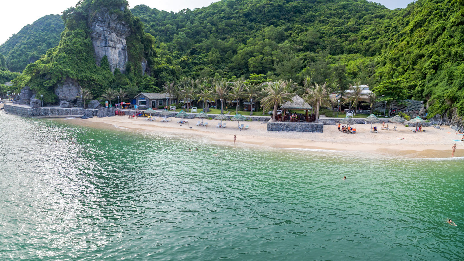 A gorgeous beach with emerald seawater and white sand in Cat Ba