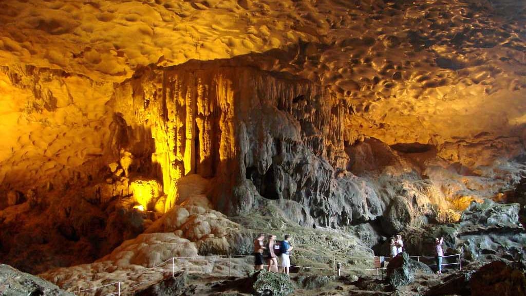 Visit famous caves in Halong Bay